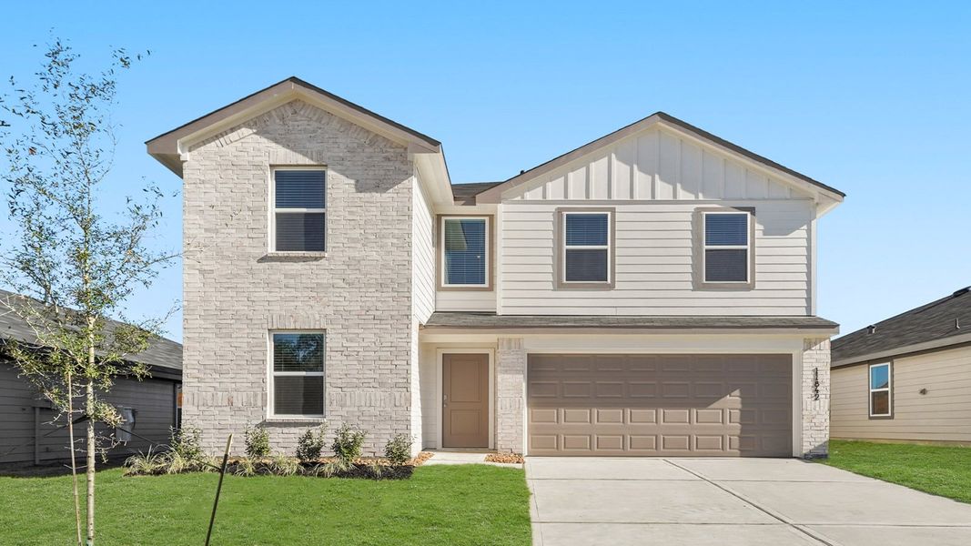 Front exterior of a new home in Westward Pointe, Sealy, TX, highlighting curb appeal (Image 1). Front exterior of a new home in Westward Pointe, Sealy, TX, highlighting curb appeal (Image 1).