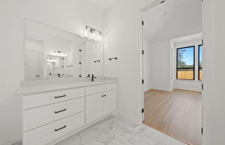 Furnished interior view inside a new home in 6 Creeks, Kyle (Image 9).