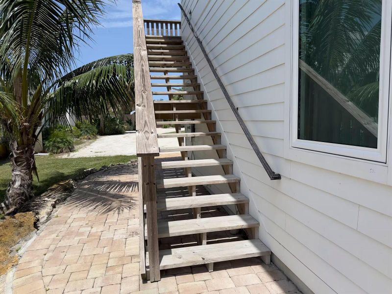 staircase to upper screened porch above staircase to upper screened porch above