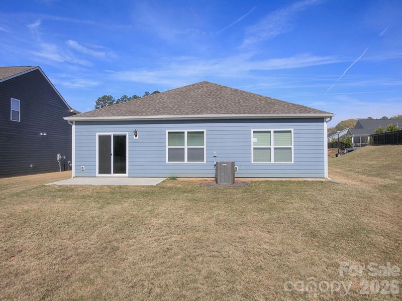 Exterior details and patio area of a home in Villas at Sherrills Ford, Terrell (Image 4).