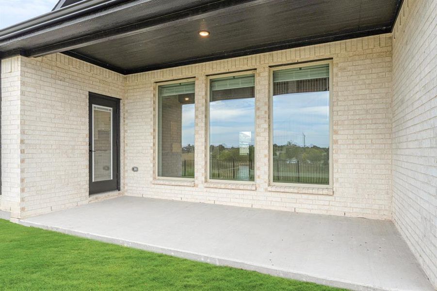 Exterior details and patio area of a home in Devonshire Classic 60-65, Forney (Image 28).