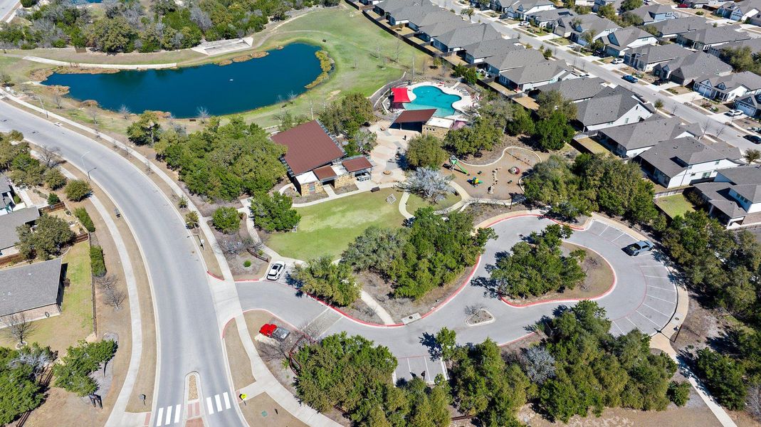 Birds eye view of property featuring a water view and a residential view