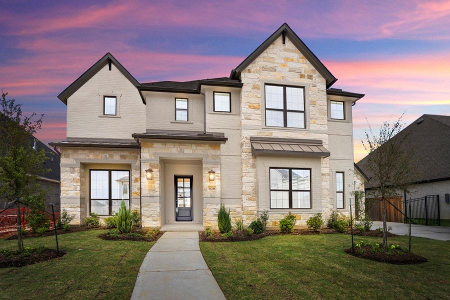 Front exterior of a new home in Jordan Ranch 70' Lots, Fulshear, TX, highlighting curb appeal (Image 22). Front exterior of a new home in Jordan Ranch 70' Lots, Fulshear, TX, highlighting curb appeal (Image 22).