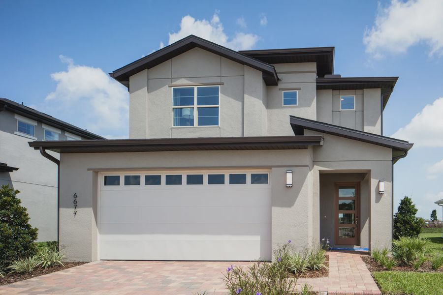 Representative exterior photo of a completed home built from the Lucerne II by Jones Homes USA in Reserve at Twin Lakes, St. Cloud, FL (Image 7). Representative exterior photo of a completed home built from the Lucerne II by Jones Homes USA in Reserve at Twin Lakes, St. Cloud, FL (Image 7).