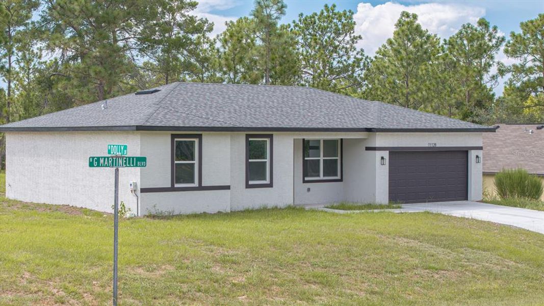 Front exterior of a new home in , Citrus Springs, FL, highlighting curb appeal (Image 25).