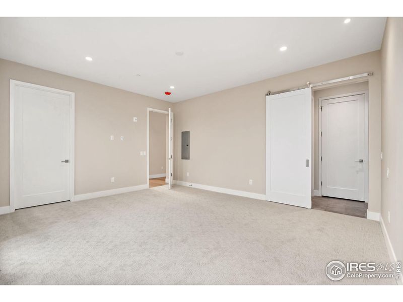 Primary bedroom includes two closets with an attached laundry room.