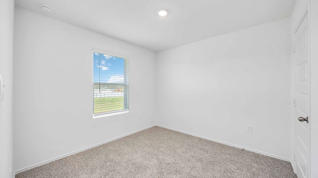 Representative unfurnished interior of a home built from the Franklin by D.R. Horton in Legacy Village, Houston (Image 14).