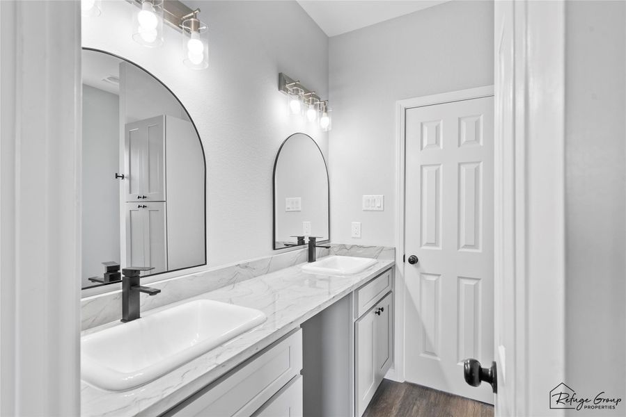 Jack and Jill Bathroom from Bed 1 with double sinks and granite countertop Jack and Jill Bathroom from Bed 1 with double sinks and granite countertop