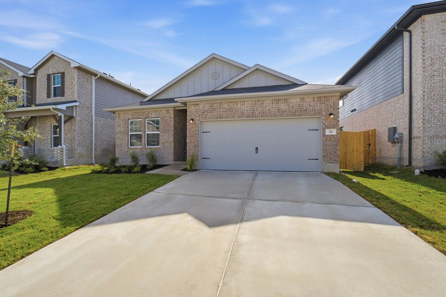 Front exterior of a new home in Sunfield, Buda, TX, highlighting curb appeal (Image 2). Front exterior of a new home in Sunfield, Buda, TX, highlighting curb appeal (Image 2).