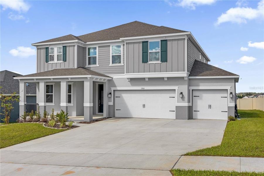 Front exterior of a new home in , Minneola, FL, highlighting curb appeal (Image 1). Front exterior of a new home in , Minneola, FL, highlighting curb appeal (Image 1).