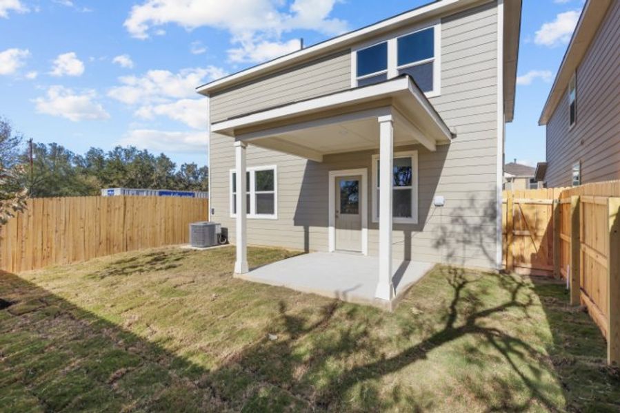 A house with a fence and grass. A house with a fence and grass.