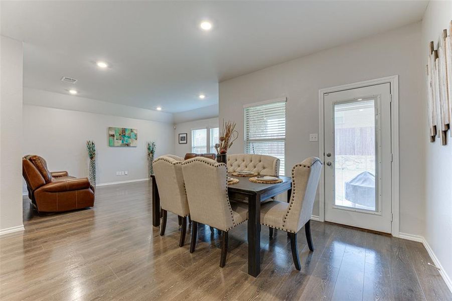 Dining space with wood-type flooring