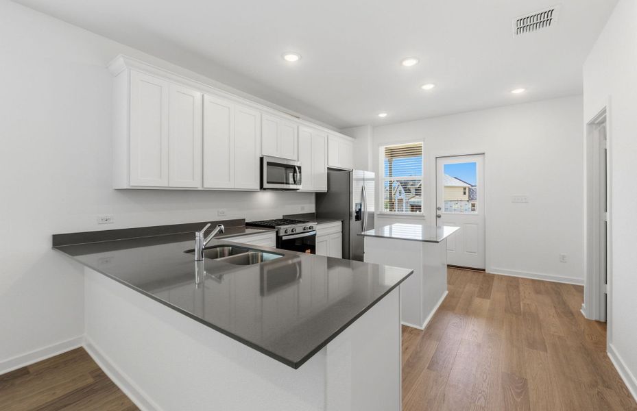 Furnished interior view inside a new home in Crosswinds, Kyle (Image 9).