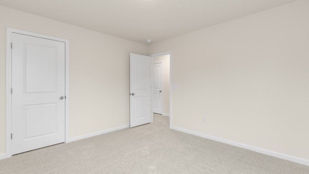 Spacious, unfurnished interior of a new home in The Estates at Edinborough, Gibsonville (Image 30).