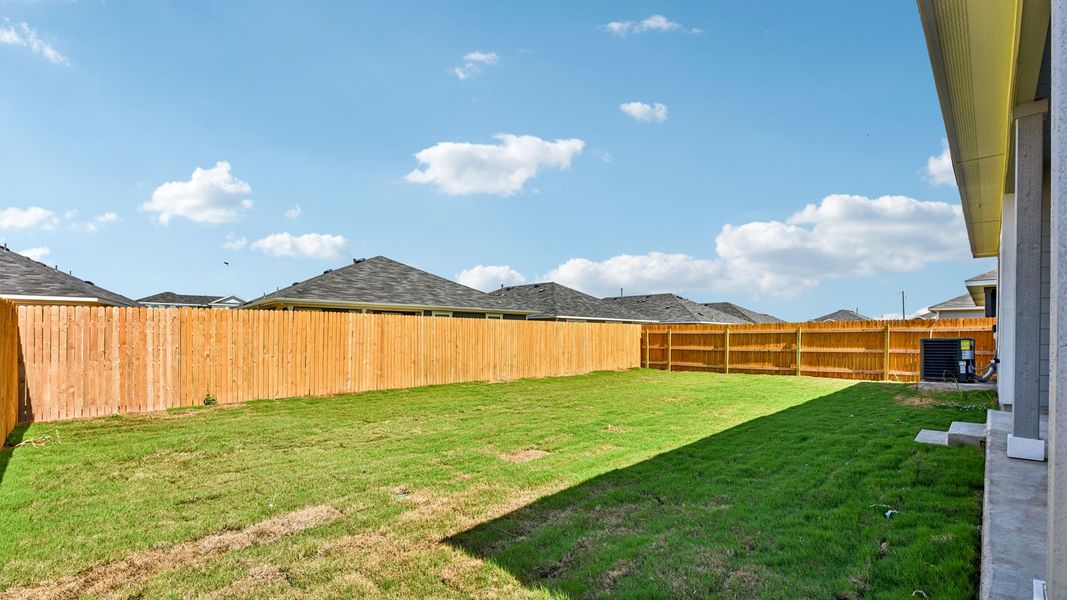 Exterior details and patio area of a home in Monarch Ranch, Manor (Image 24).