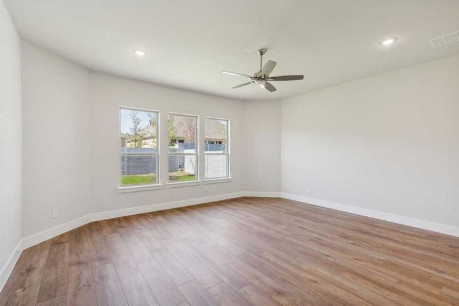 Unfurnished room featuring light hardwood / wood-style floors and ceiling fan