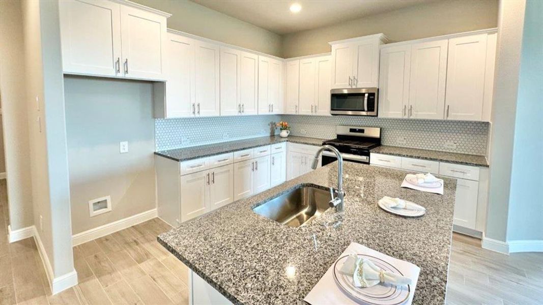 Kitchen - All Home and community information, including pricing, included features, terms, availability and amenities, are subject to change at any time without notice or obligation. All Drawings, pictures, photographs, video, square footages, floor plans, elevations, features, colors and sizes are approximate for illustration purposes only and will vary from the homes as built. Kitchen - All Home and community information, including pricing, included features, terms, availability and amenities, are subject to change at any time without notice or obligation. All Drawings, pictures, photographs, video, square footages, floor plans, elevations, features, colors and sizes are approximate for illustration purposes only and will vary from the homes as built.