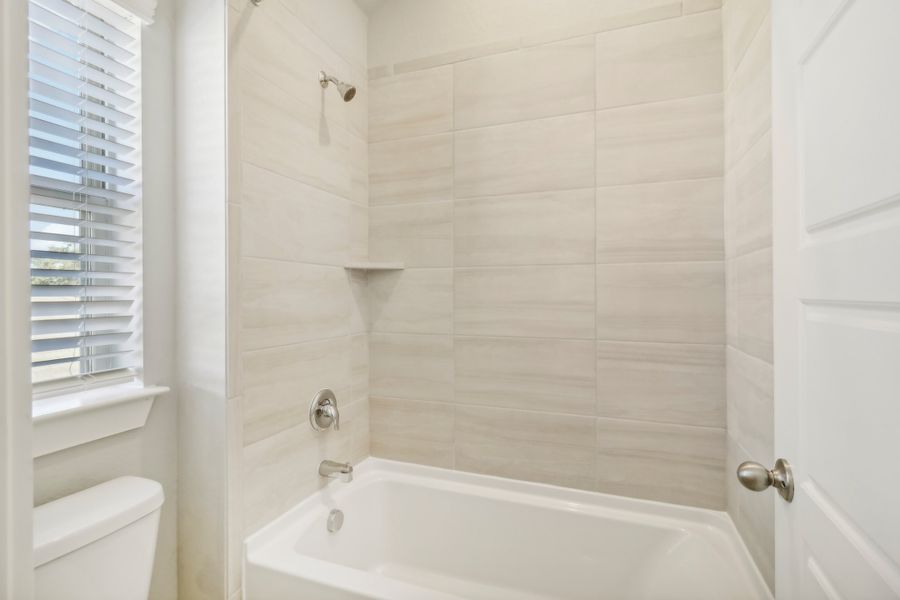 Guest bathroom in the Cedar floorplan at a Meritage Homes community.