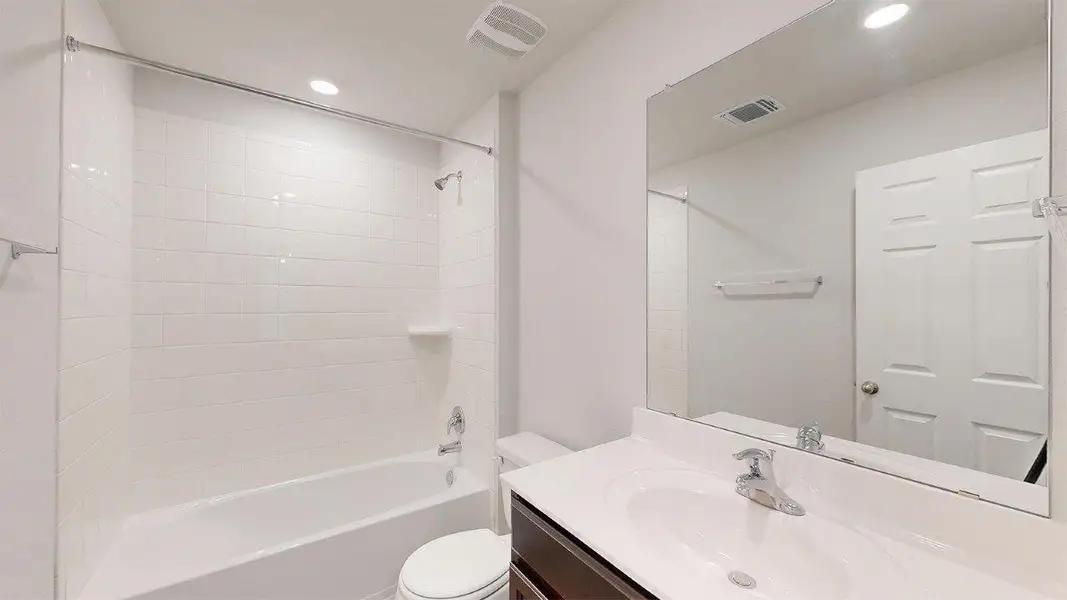 Full bathroom with vanity, bathtub / shower combination, and recessed lighting Full bathroom with vanity, bathtub / shower combination, and recessed lighting