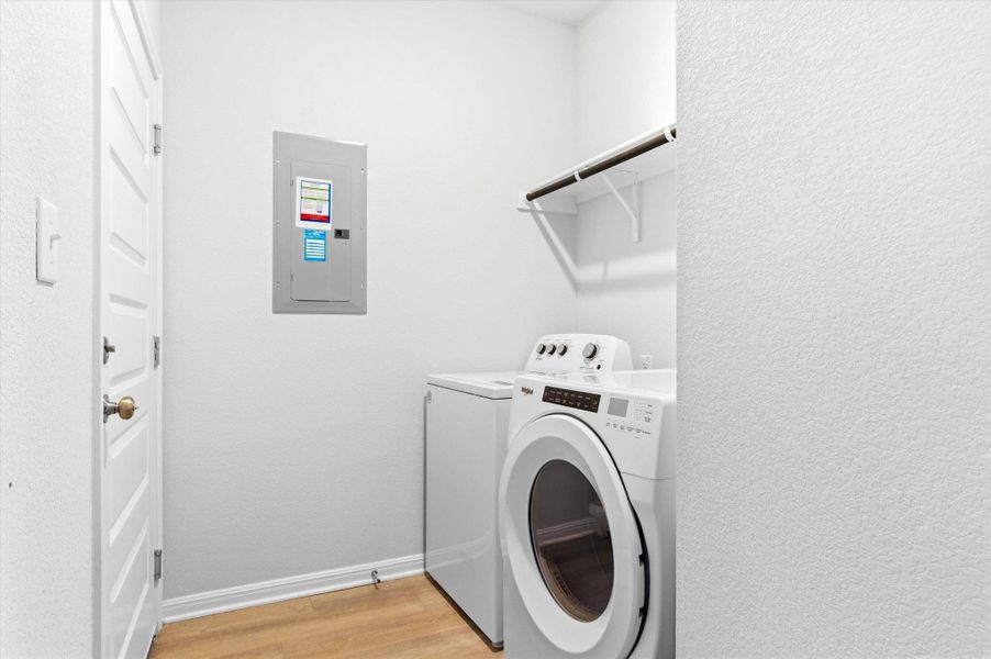 Laundry room off the foyer adjacent to the garage