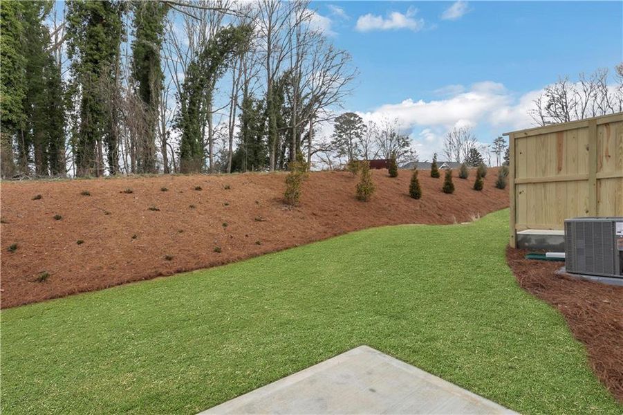 Exterior details and patio area of a home in Villas at Dawsonville Townhomes, Dawsonville (Image 4).