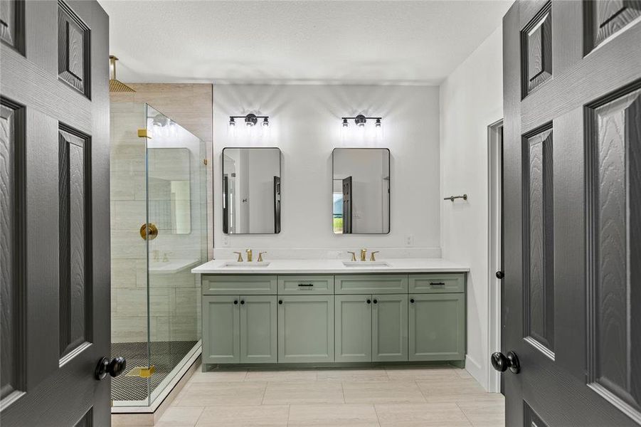 Stunning main bathroom with glass shower.