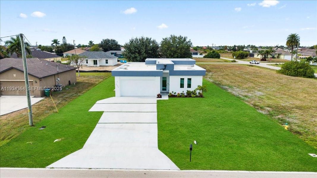 Front exterior of a new home in , Cape Coral, FL, highlighting curb appeal (Image 21).