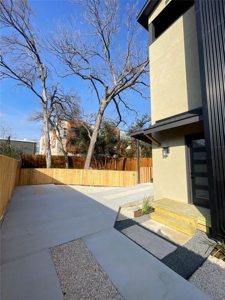Fenced backyard with a patio