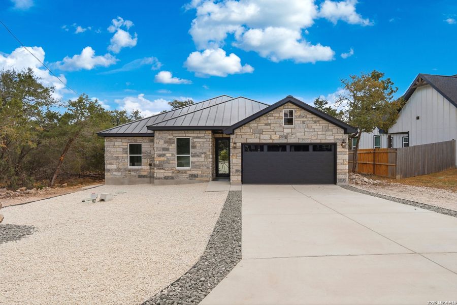 Front exterior of a new home in , Spring Branch, TX, highlighting curb appeal (Image 21).