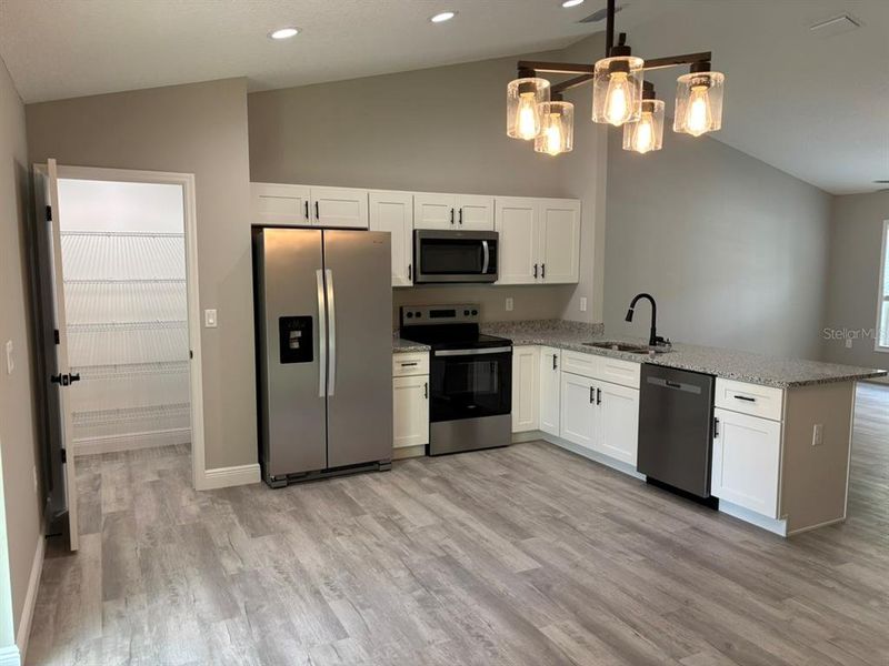Furnished interior view inside a new home in , Dunnellon (Image 7).