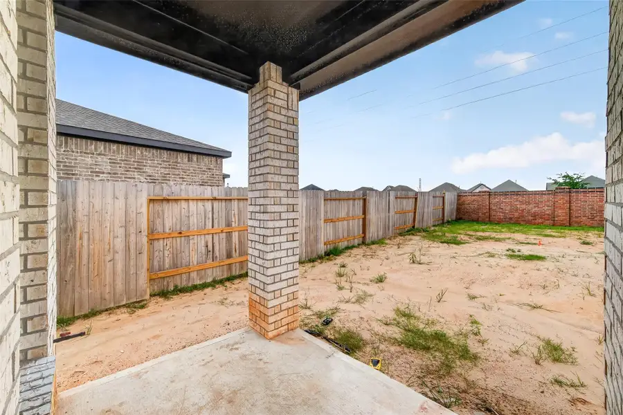 Exterior details and patio area of a home in Sunterra, Katy (Image 4).