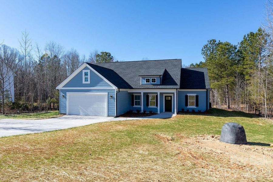Front exterior of a new home in , Clover, SC, highlighting curb appeal (Image 25).
