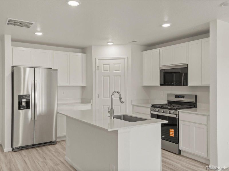 Furnished interior view inside a new home in Skyview at High Point, Aurora (Image 11).