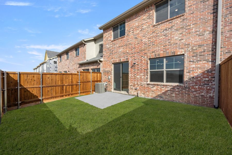 Exterior details and patio area of a home in Wildridge, Oak Point (Image 3).