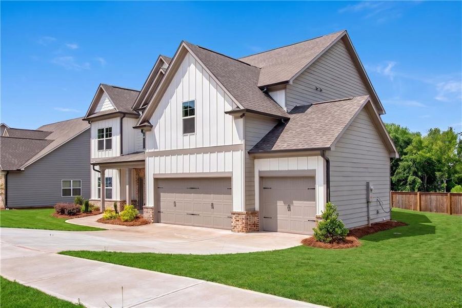 Front exterior of a new home in Hidden Fields, Hoschton, GA, highlighting curb appeal (Image 26).