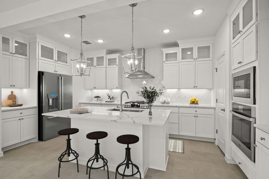 Stunning kitchen with white stacked cabinets (*Photo not of actual home and used for illustration purposes only.)