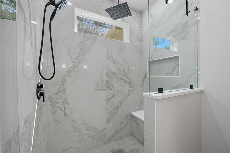 Bathroom featuring a marble finish shower Bathroom featuring a marble finish shower