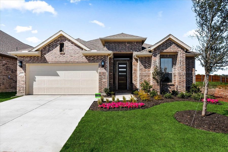 Front exterior of a new home in Oaks of North Grove, Waxahachie, TX, highlighting curb appeal (Image 13).