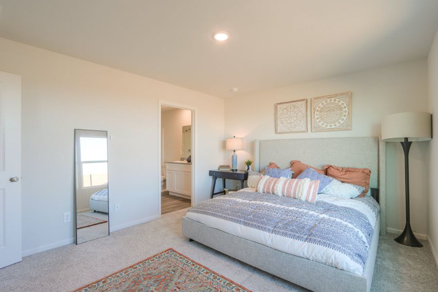 A bedroom with a bed and lamps. A bedroom with a bed and lamps.