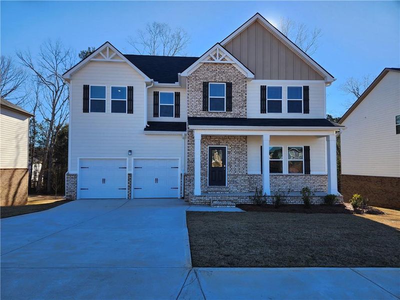 Front exterior of a new home in Southern Hills, McDonough, GA, highlighting curb appeal (Image 1). Front exterior of a new home in Southern Hills, McDonough, GA, highlighting curb appeal (Image 1).