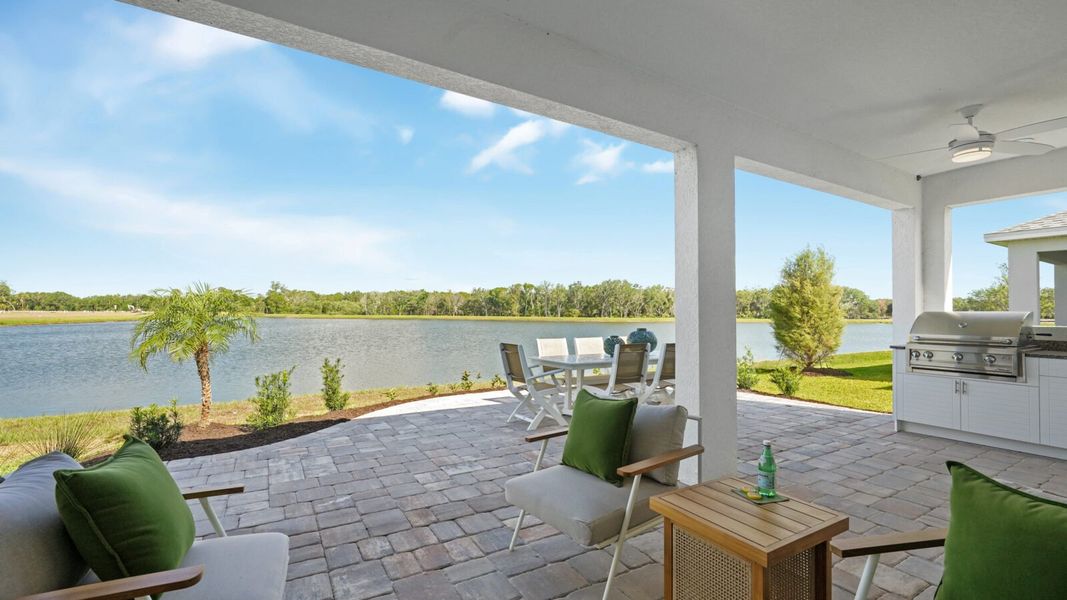 Exterior details and patio area of a home in Wildleaf, Parrish (Image 35).