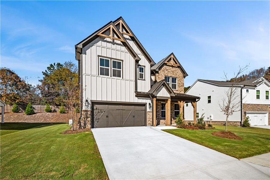 Front exterior of a new home in The Paddocks at Doc Hughes, Buford, GA, highlighting curb appeal (Image 2).