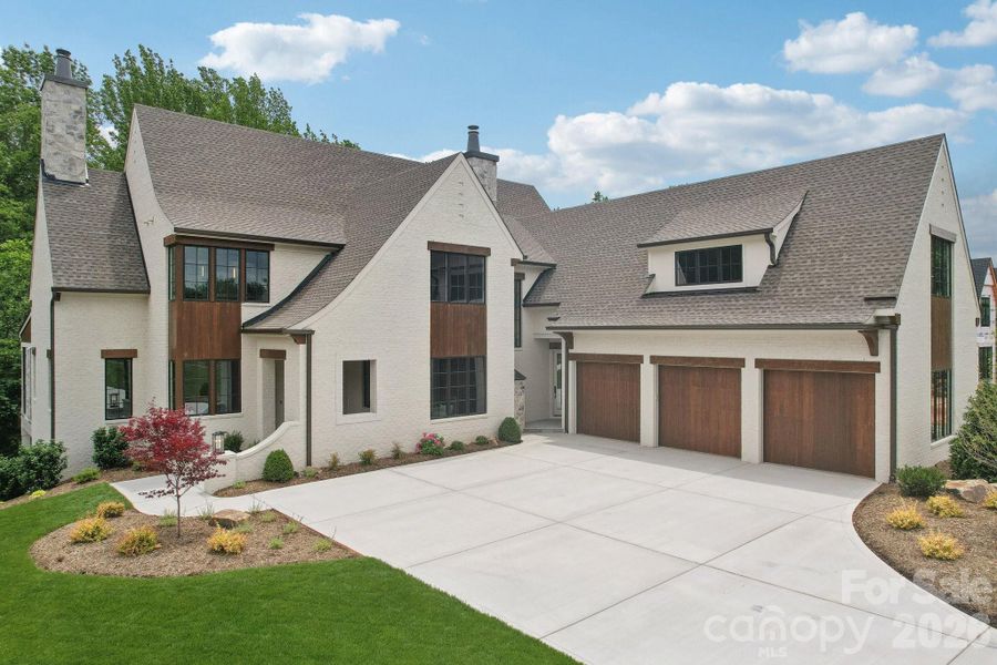 Front exterior of a new home in Cardinal Crest, Weddington, NC, highlighting curb appeal (Image 27). Front exterior of a new home in Cardinal Crest, Weddington, NC, highlighting curb appeal (Image 27).
