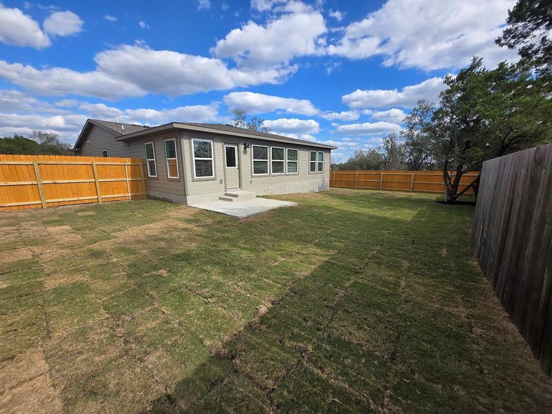 Back of house with a patio area and a fenced backyard Back of house with a patio area and a fenced backyard