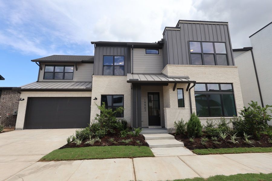 Front exterior of a new home in Easthaven at Bridgeland Central - Horizon Collection, Cypress, TX, highlighting curb appeal (Image 1). Front exterior of a new home in Easthaven at Bridgeland Central - Horizon Collection, Cypress, TX, highlighting curb appeal (Image 1).
