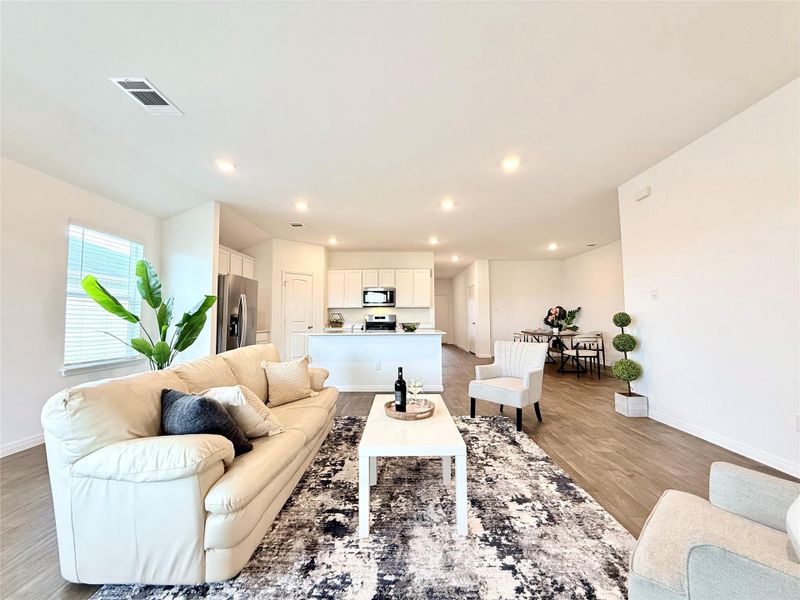 Living area featuring light wood-style floors and recessed lighting Living area featuring light wood-style floors and recessed lighting