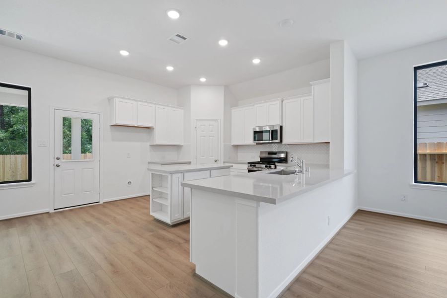 Furnished interior view inside a new home in Spring Creek Trails, Magnolia (Image 4).