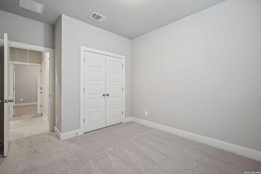 Spacious, unfurnished interior of a new home in Estancia Ranch - Premier Series, San Antonio (Image 21).