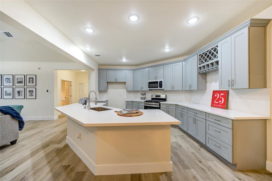 Spacious kitchen with modern cabinetry, sleek countertops, and a central island for effortless entertaining.