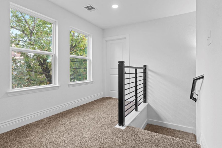 To the left, you’ll discover the hallway lined with beautiful windows that fill the space with natural light, leading you into the private primary suite. Simply stunning! To the left, you’ll discover the hallway lined with beautiful windows that fill the space with natural light, leading you into the private primary suite. Simply stunning!